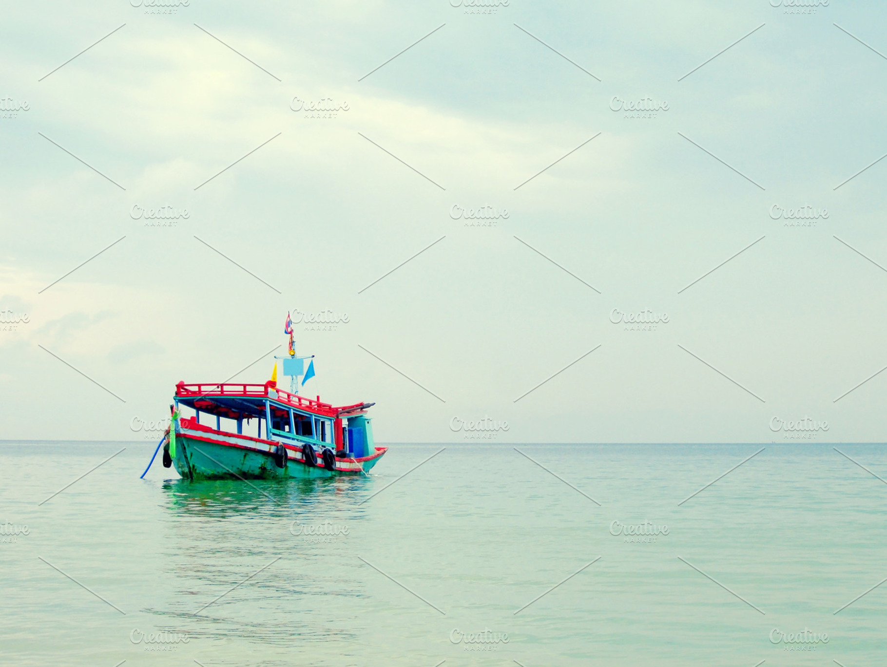 A Wooden Boat Floating On The Sea