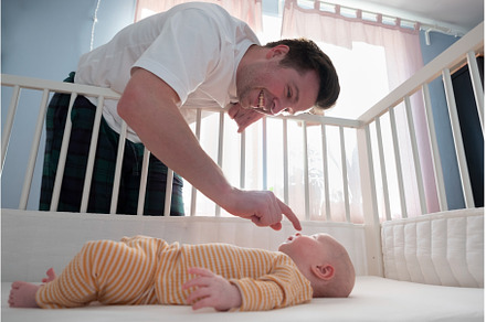 Young man playing with his little, a Person Photo by Koldunova