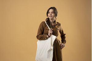 Stylish young woman in brown dress, a Person Photo by volodymyrshtun13795