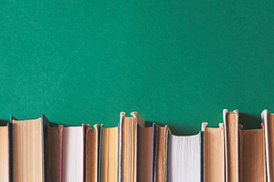 Old books on a dark green background