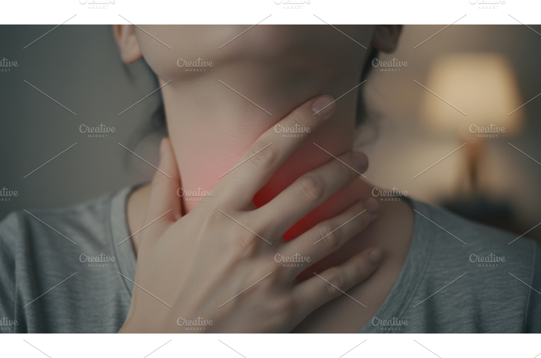 Woman touching her throat with, a Health & Medical Photo by Igor Tichonow
