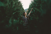 Girl decorating christmas tree featuring christmas, tree, and forest, a Holiday Photo by remi + tori (Thumbnail 1 of 2)