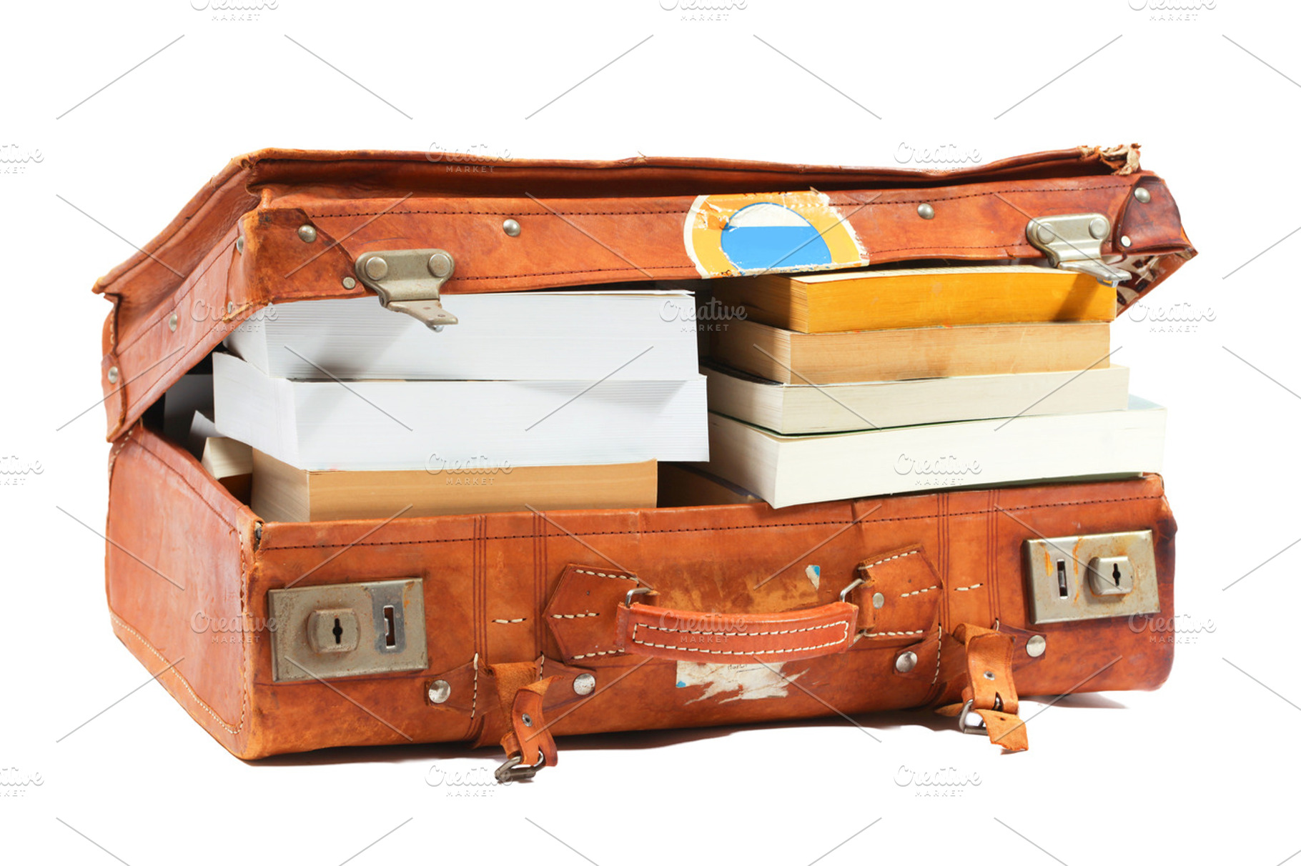 Open suitcase stuffed with books