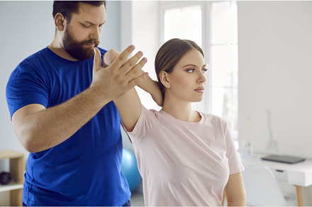Serious male physiotherapist, a Health & Medical Photo by StudioRomantic
