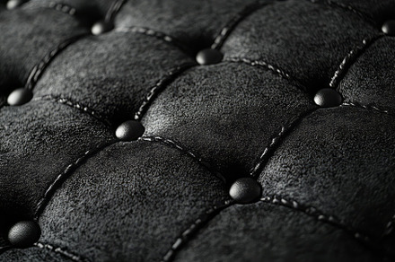 Close-up of luxurious black tufted leather upholstery, showcasing the rich text, a Background Photo by ImageMir