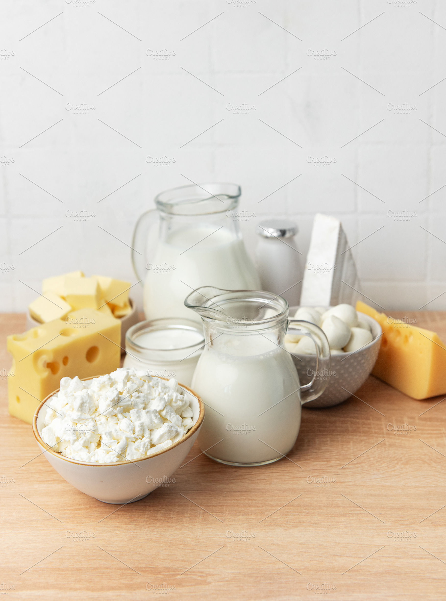 Various dairy products on a wooden table, healthy food concept, a Food & Drink Photo by Olena Rudo
