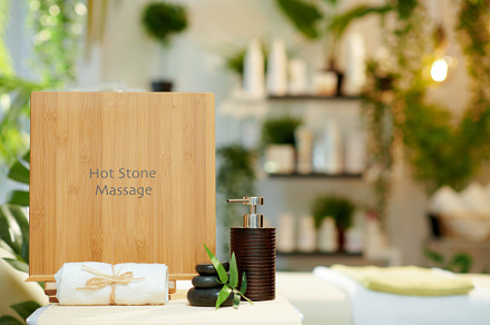 towel, hot stone massage and massage table in beauty salon, a Health & Medical Photo by Alliance Images