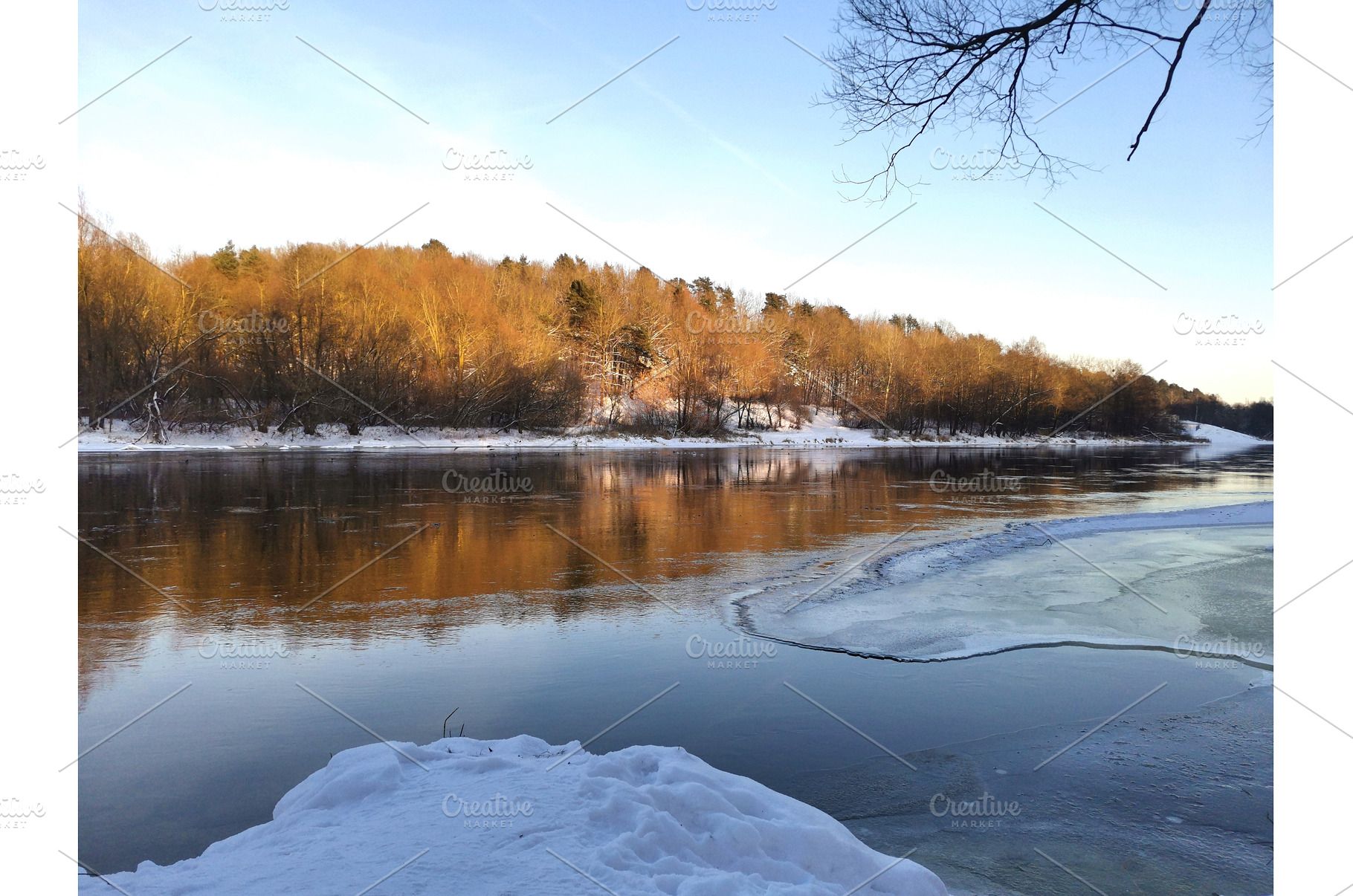 Partially frozen river on clear day, a Nature Photo by Tati_Kli