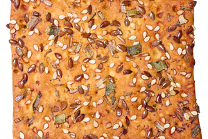 Crispy bread sprinkled with flax and sesame seeds, dried herbs,, a Food & Drink Photo by ndanko