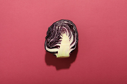 Half of cabbage on pink background, top view, a Food & Drink Photo by AtlasStudio