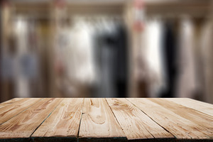 Wooden surface on blurred background of the room in apartment.Mock up.