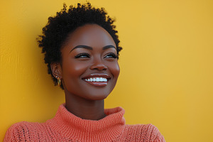 Smiling woman in soft pink sweater with short curly hair standing against textu, a Person Photo by José Manuel Gelpi