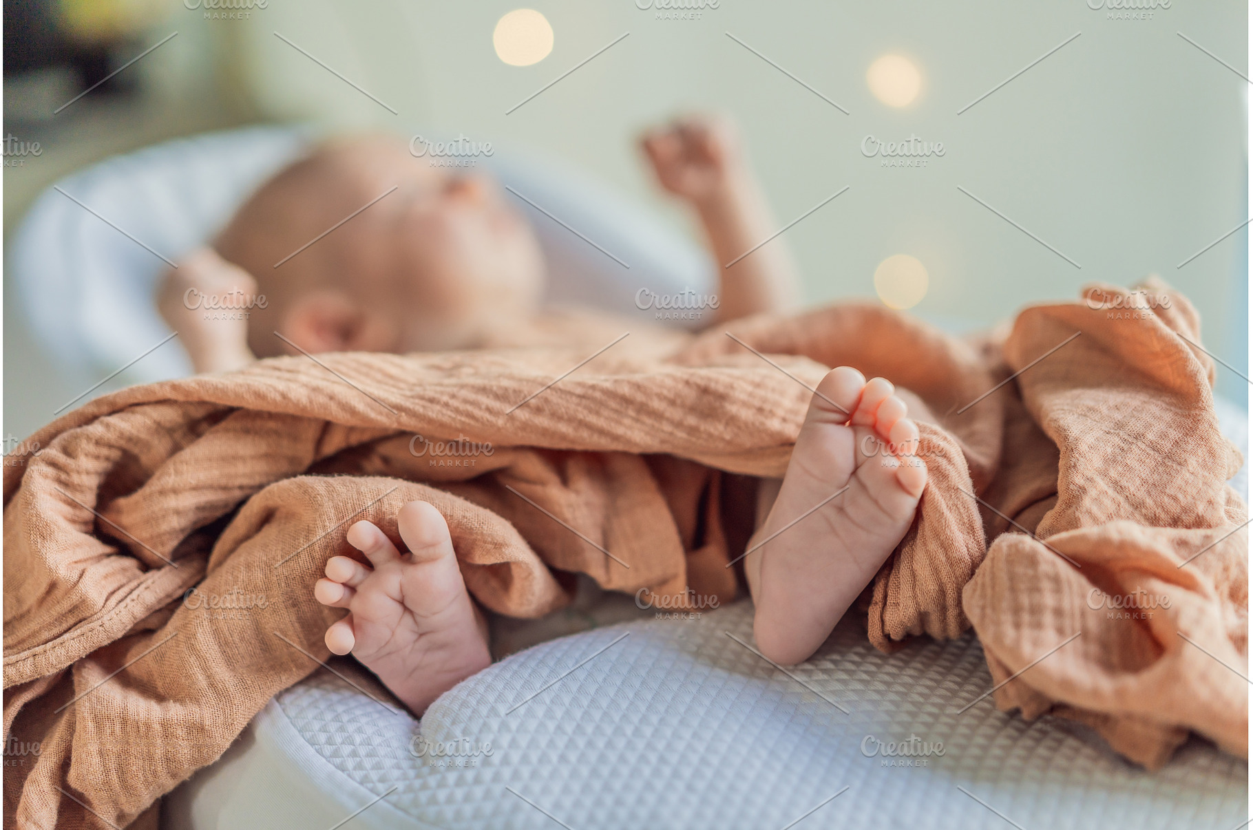 Newborn baby comfortably resting in, a Health & Medical Photo by Elizaveta Galitskaya
