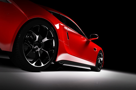 Side view of modern red sports car in a spotlight, a Transportation Photo by Photocreo Michal Bednarek