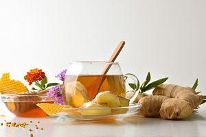 Background with glass cup with ginger and honey infusion isolate, a Food & Drink Photo by Davizro's Market