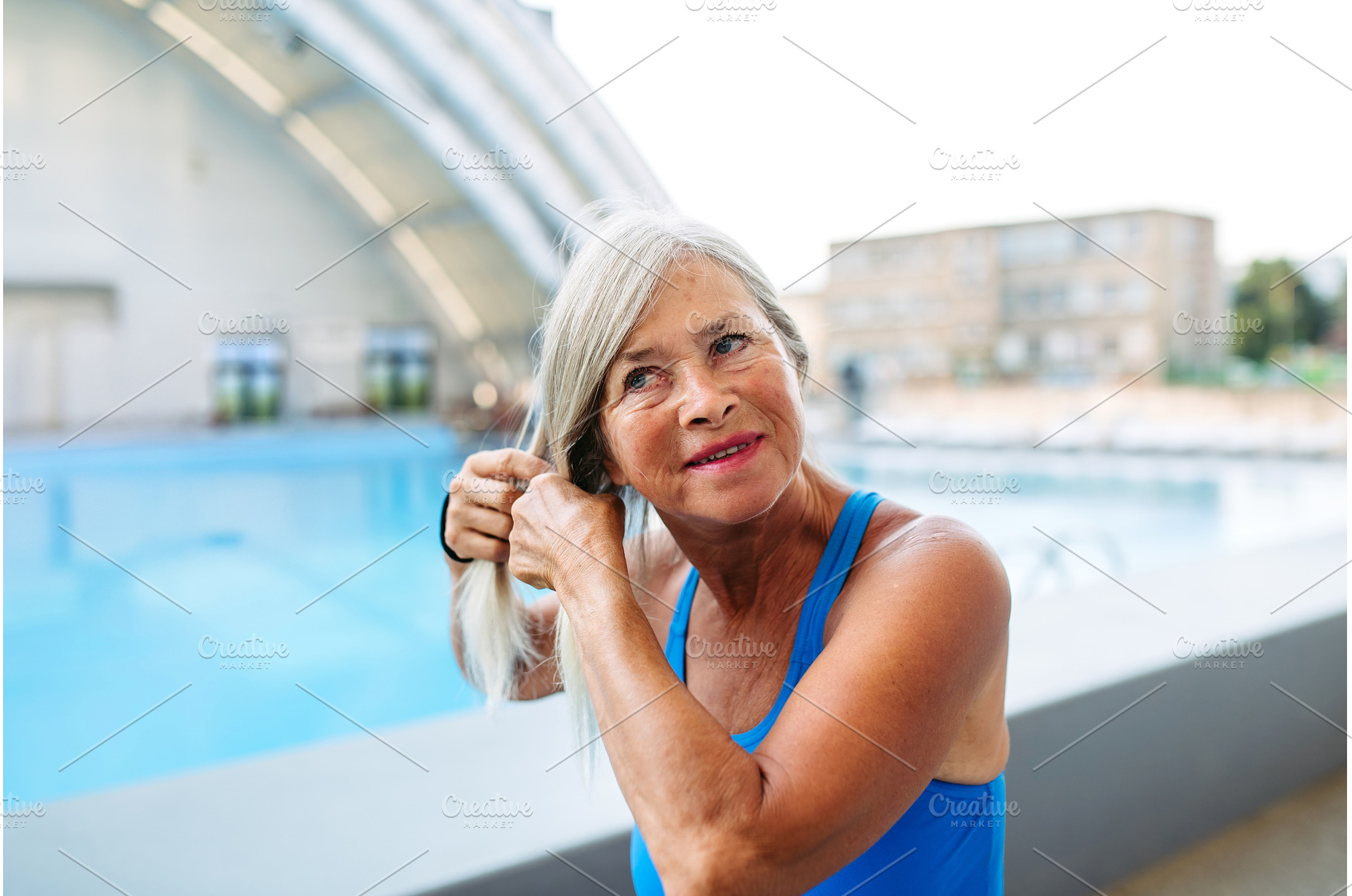 Senior woman preparing for swim t, a Sports & Recreation Photo by HalfPoint