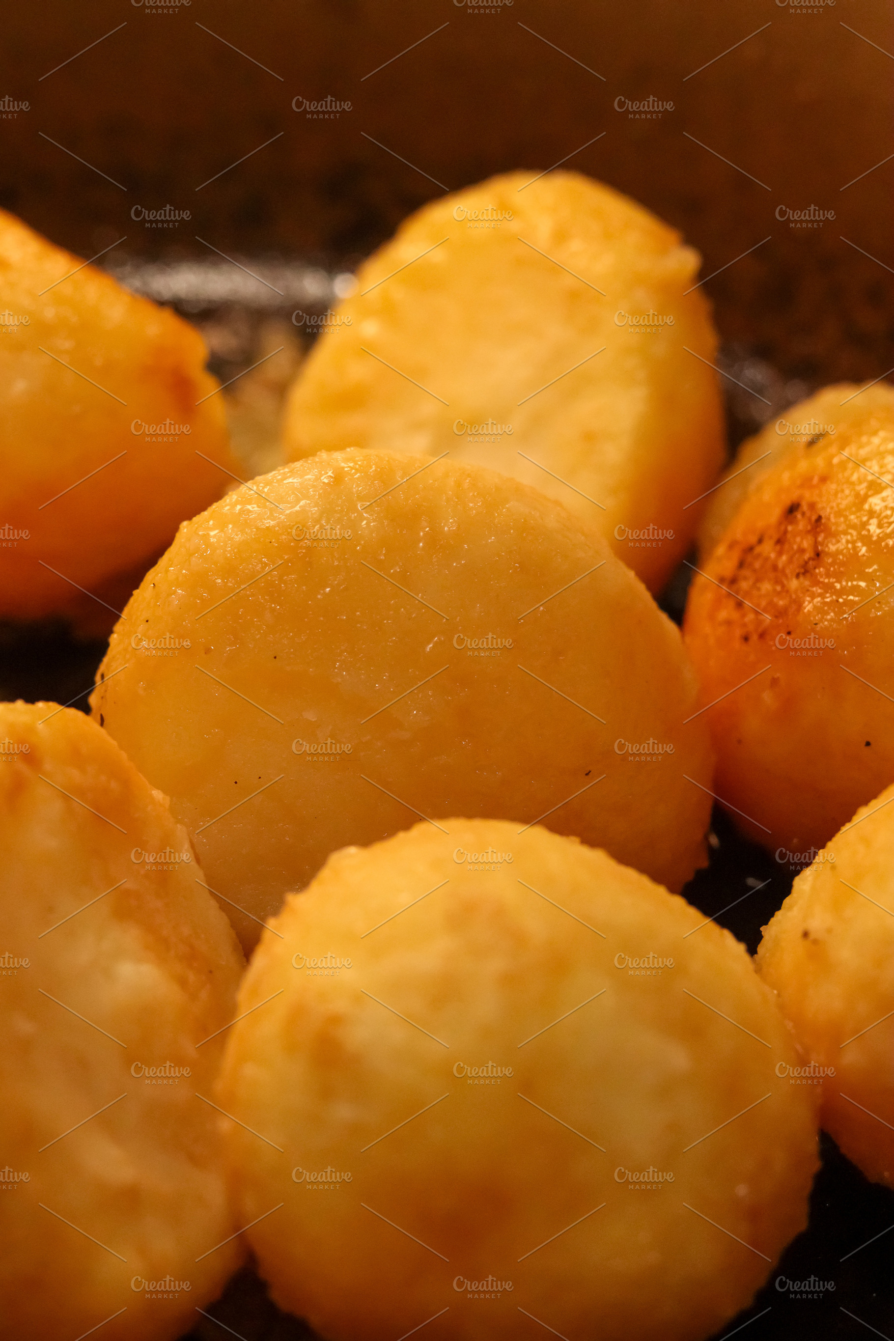 Crispy golden potatoes sizzling in hot oil, forming a delectable, a Photo by Studio ANNA