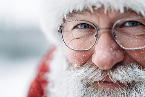 Santa Claus face with glasses, snow, a Holiday Photo by MistyDay