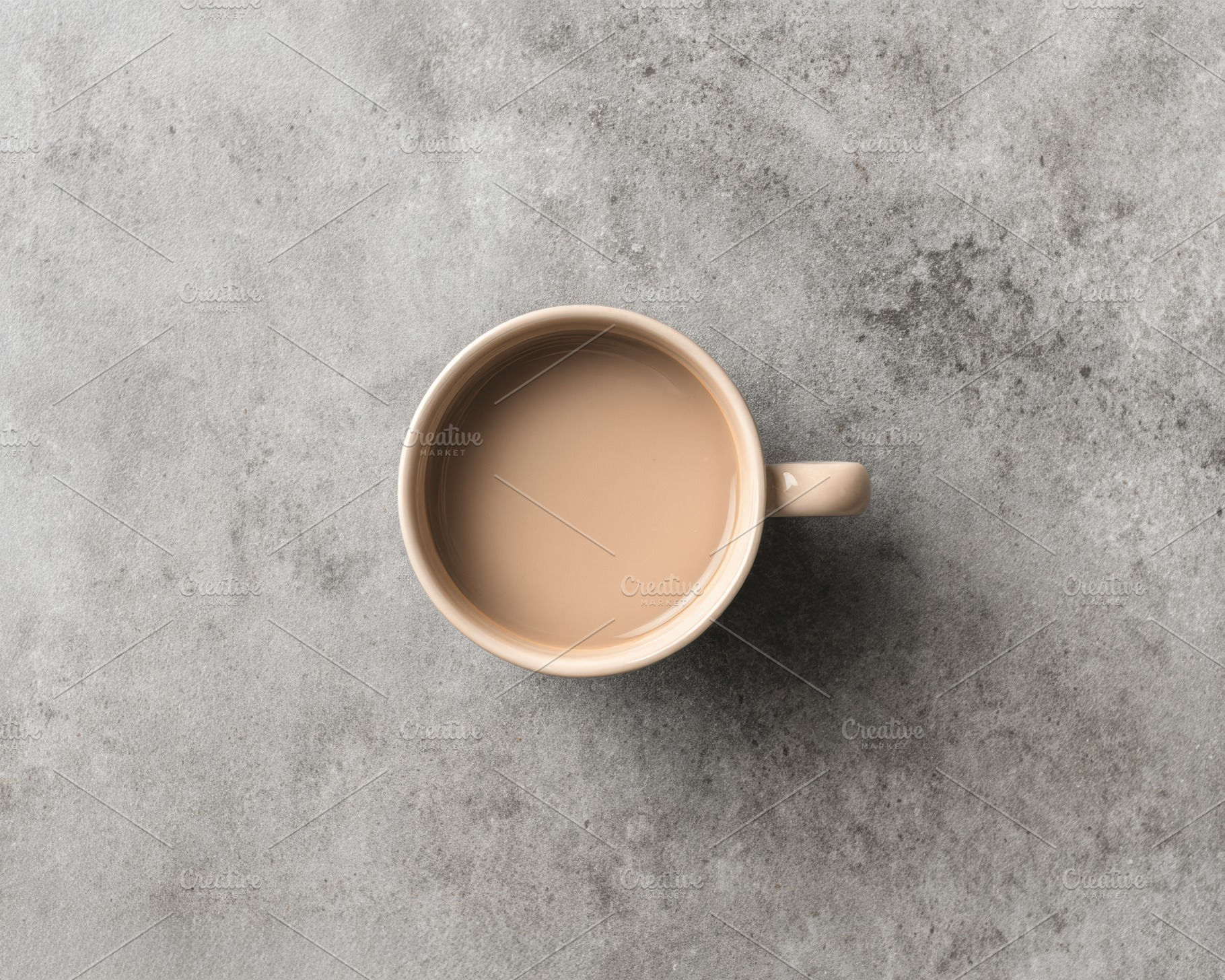 Beige ceramic mug on stone surface, a Food & Drink Photo by Virgo Studio