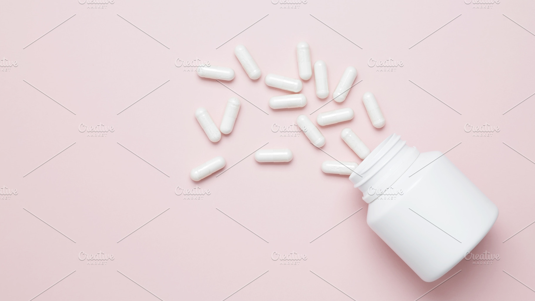 Concept of healthcare and medicine. White bottle container with medication caps, a Photo by matucha