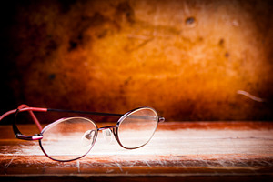 Old Glasses on Desk, a School & Education Photo by THP Creative
