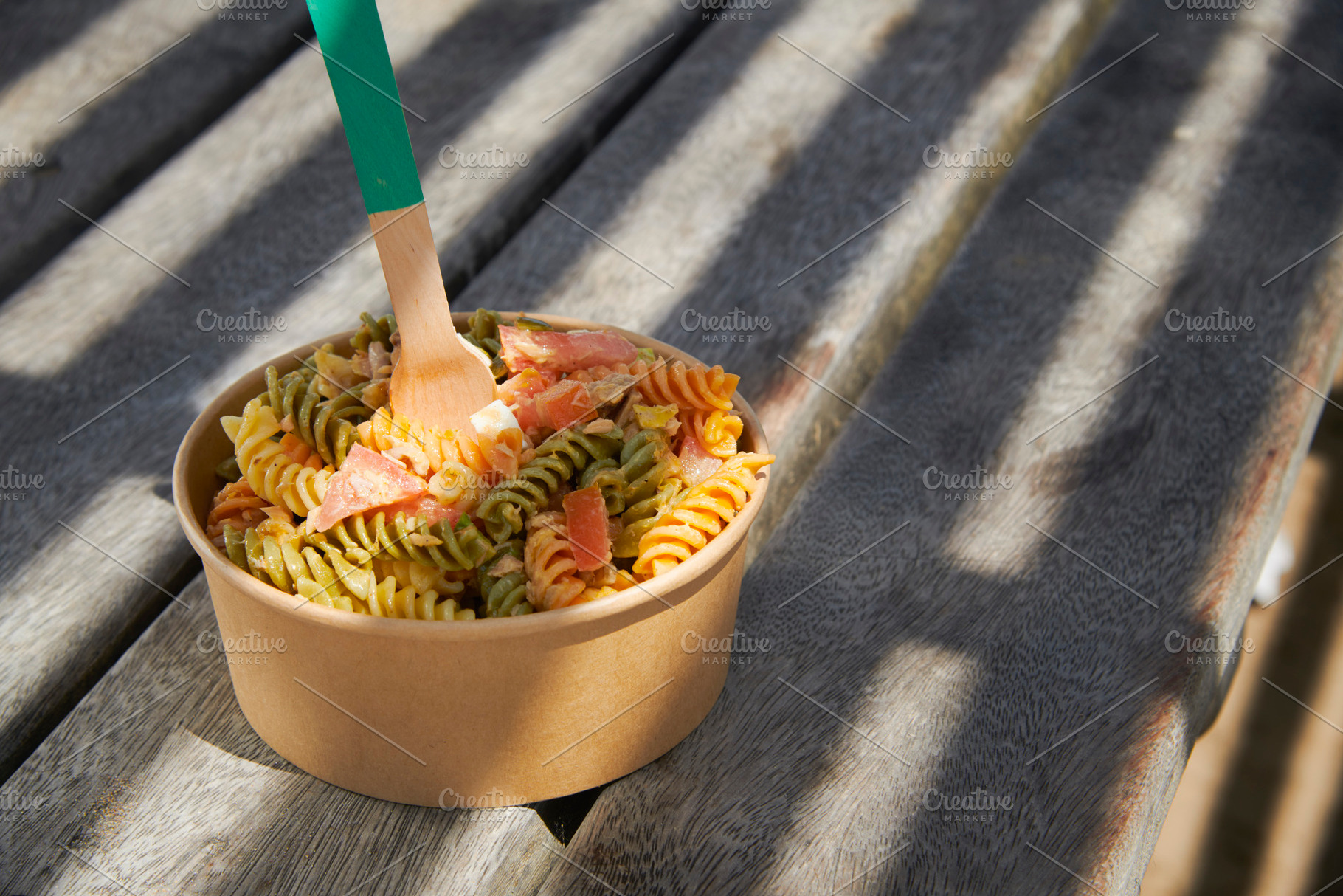 pasta salad served in a brown paper takeout bowl, a Photo by Nito