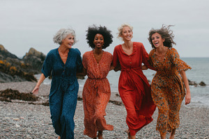 Women enjoying a beach day together, a Photo by Beautiful things