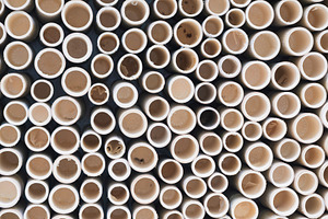 bamboo pile stacked vertically create texture wall background. C, a Photo by Casanowe-studio