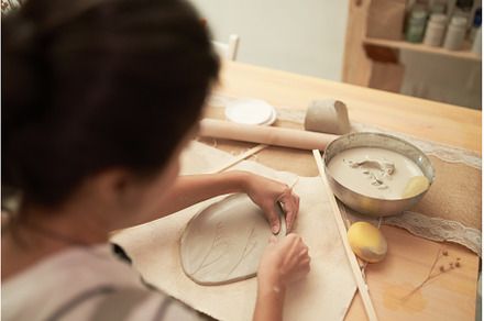 Ceramic artist shaping clay slab, an Arts & Entertainment Photo by Sergey Mironov's store