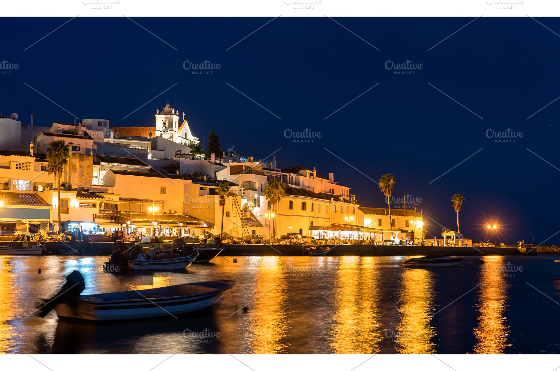 Ferragudo village with fishing boats, an Architecture Photo by Leonid Andronov