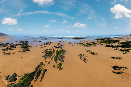 Rock formations on sandy beach (Portugal)., a Nature Photo by YuriyB