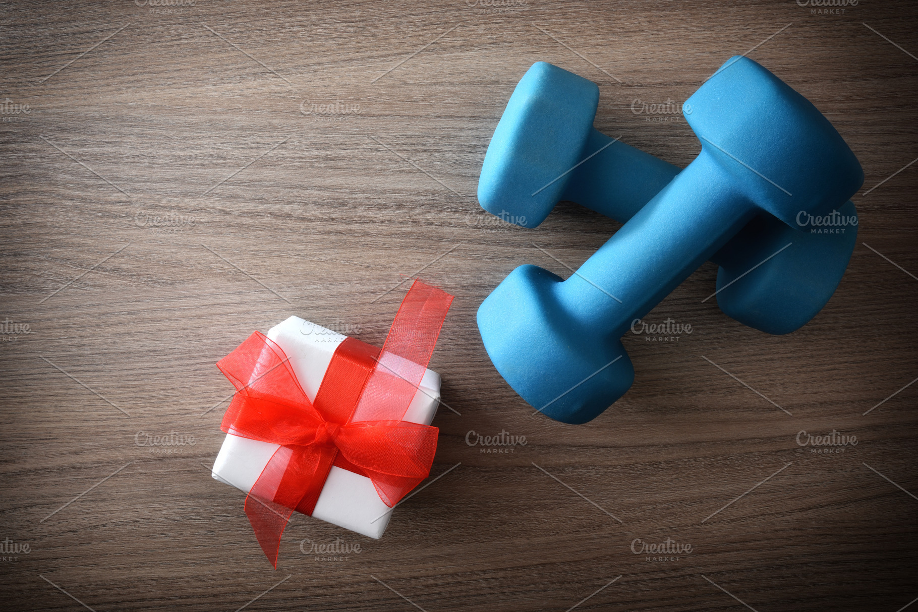 Sports session gift concept with blue dumbbells top view, a Sports & Recreation Photo by Davizro's Market