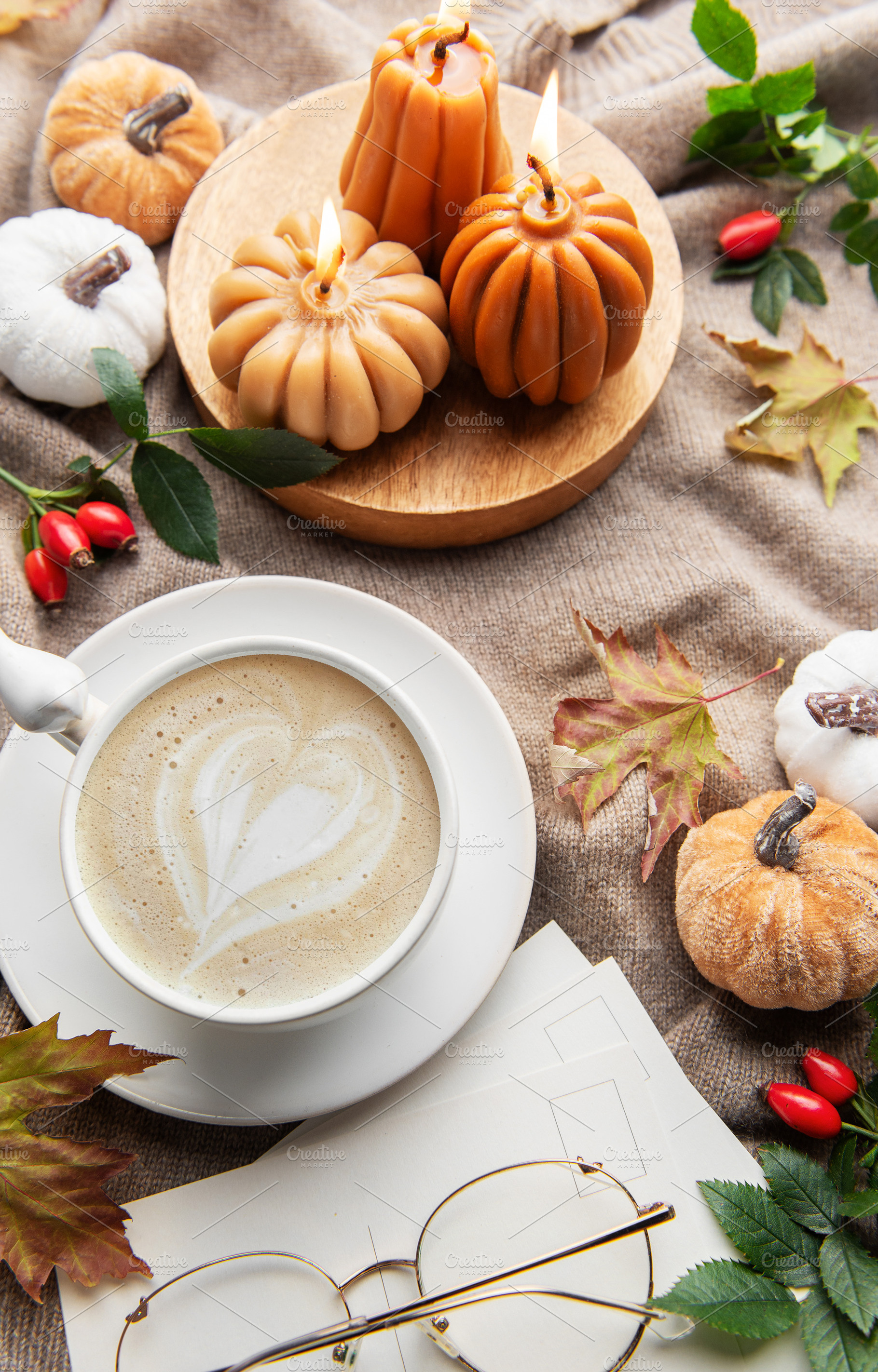 Autumn hygge flat lay with coffee and pumpkin candles, a Holiday Photo by Olena Rudo