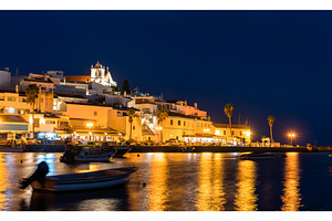 Ferragudo village with fishing boats, an Architecture Photo by Leonid Andronov