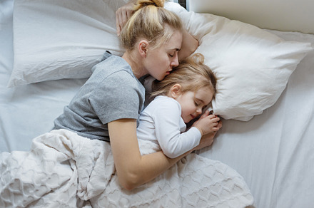 Mother and daughter sleep in bed containing fondness, lifestyle, and nap
