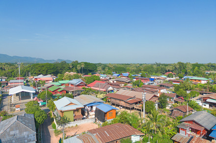 Aerial view of local residential neighborhood roofs. Urban housi