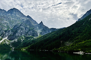 Tranquil mountain lake surrounded by rugged peaks near Zakopane Poland landscap, a Nature Photo by AS photostudio