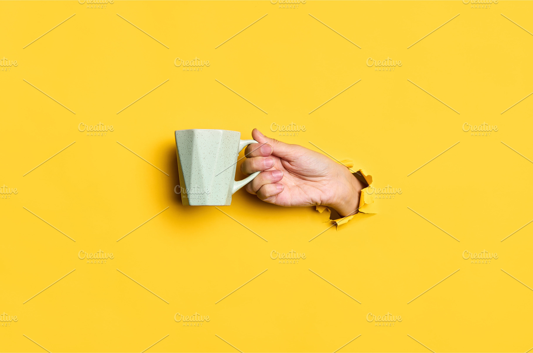 Female hand holding cup on yellow, a Food & Drink Photo by Gladkov photography