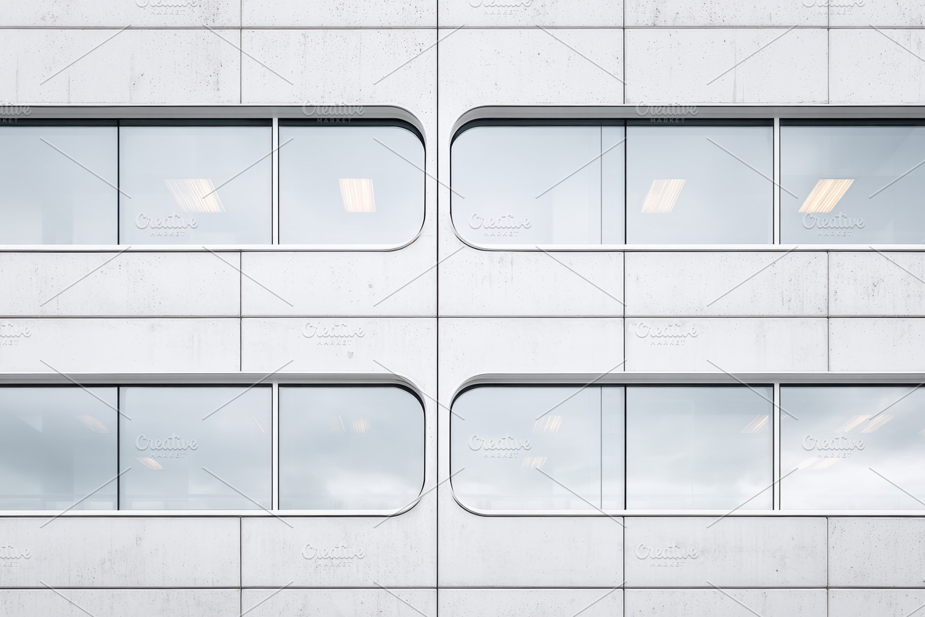 Modern concrete building facade with windows, an Architecture Photo by AlyaAnd