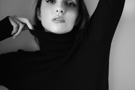 Close up portrait of a woman with pink hair and a black sweater on background i, a Person Photo by SaulichPhoto