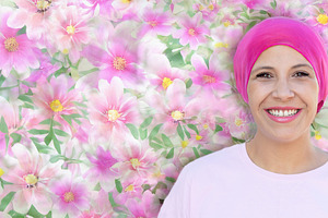 Smiling Breast Cancer Survivor in Pink Headscarf with Floral Bac, a Person Photo by José Manuel Gelpi