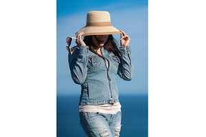 Woman in denim jacket and jeans, a Person Photo by Alexander-Piragis