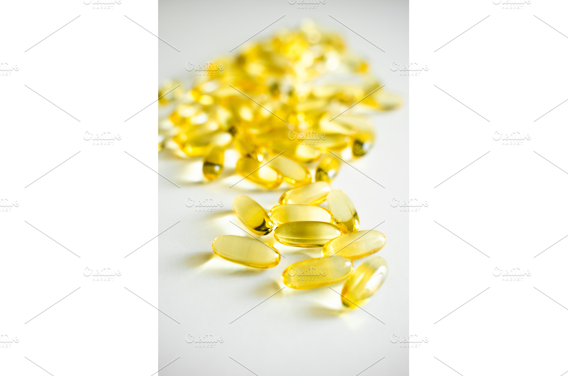 Yellow omega-3 fish oil capsules, a Health & Medical Photo by volodymyrshtun13795