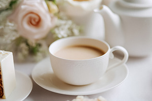 Afternoon tea setting featuring a beautifully decorated cake sli, a Photo by Studio ANNA