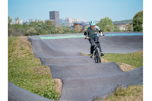 Pump track. Child on bmx bike rides, a Sports & Recreation Photo by Fascinadora