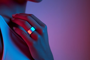 Hand in Neon Light with Smart Ring, a Technology Photo by Ocean Digital Art