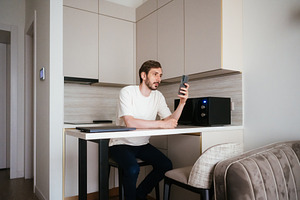 Man sitting at a modern kitchen