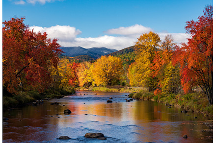 Saranac river flows through multi, a Nature Photo by Backyard Stock