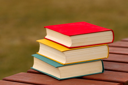 Stack of three colorful books, a School & Education Photo by Elena Vagengeim