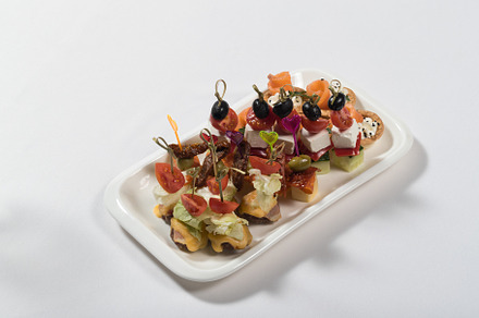 Canapes of fish vegetables meat on featuring canape, appetizer, and food, a Food & Drink Photo by oleghz